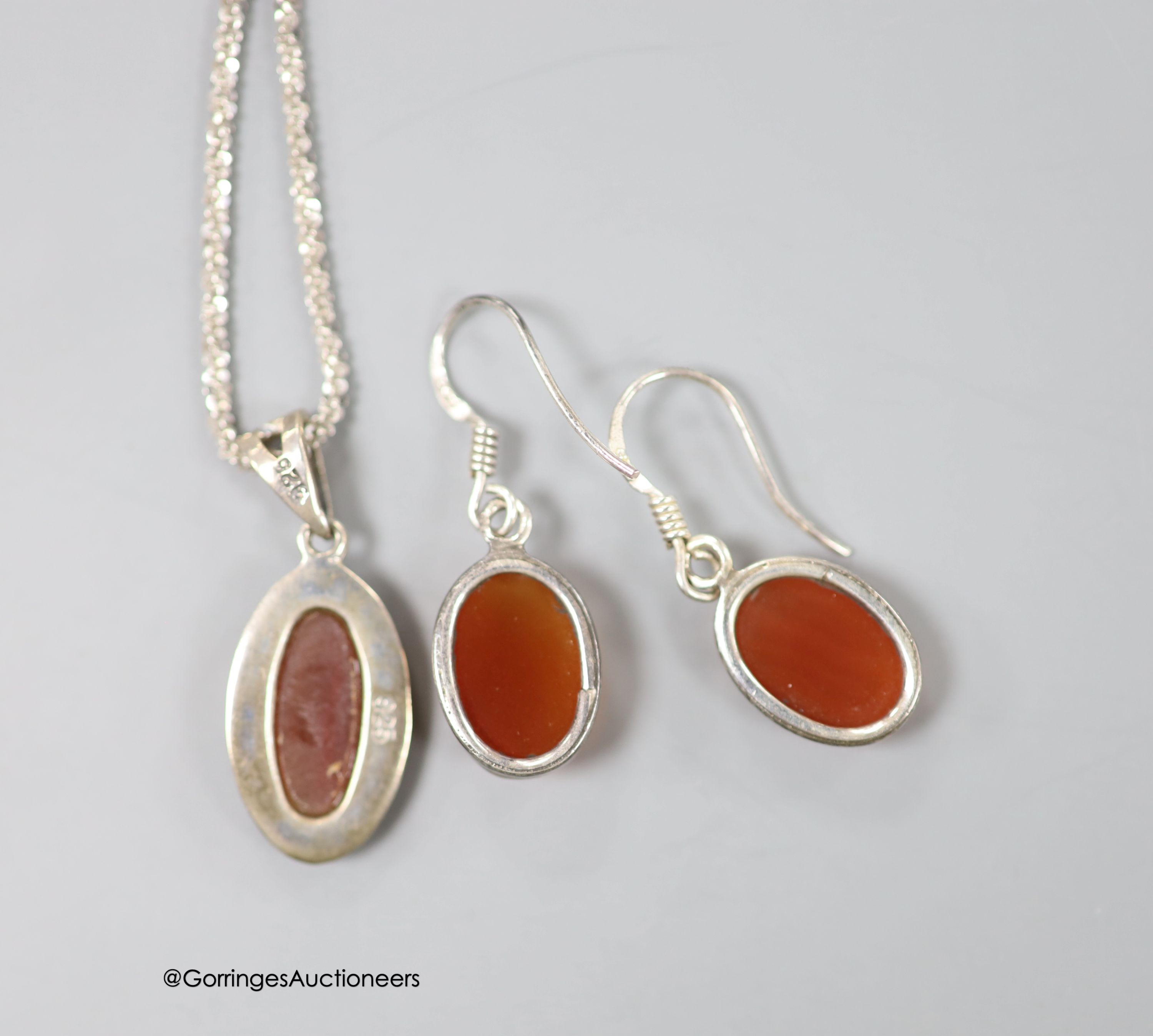 A 925, chalcedony and marcasite set necklace and a pair of similar earrings.